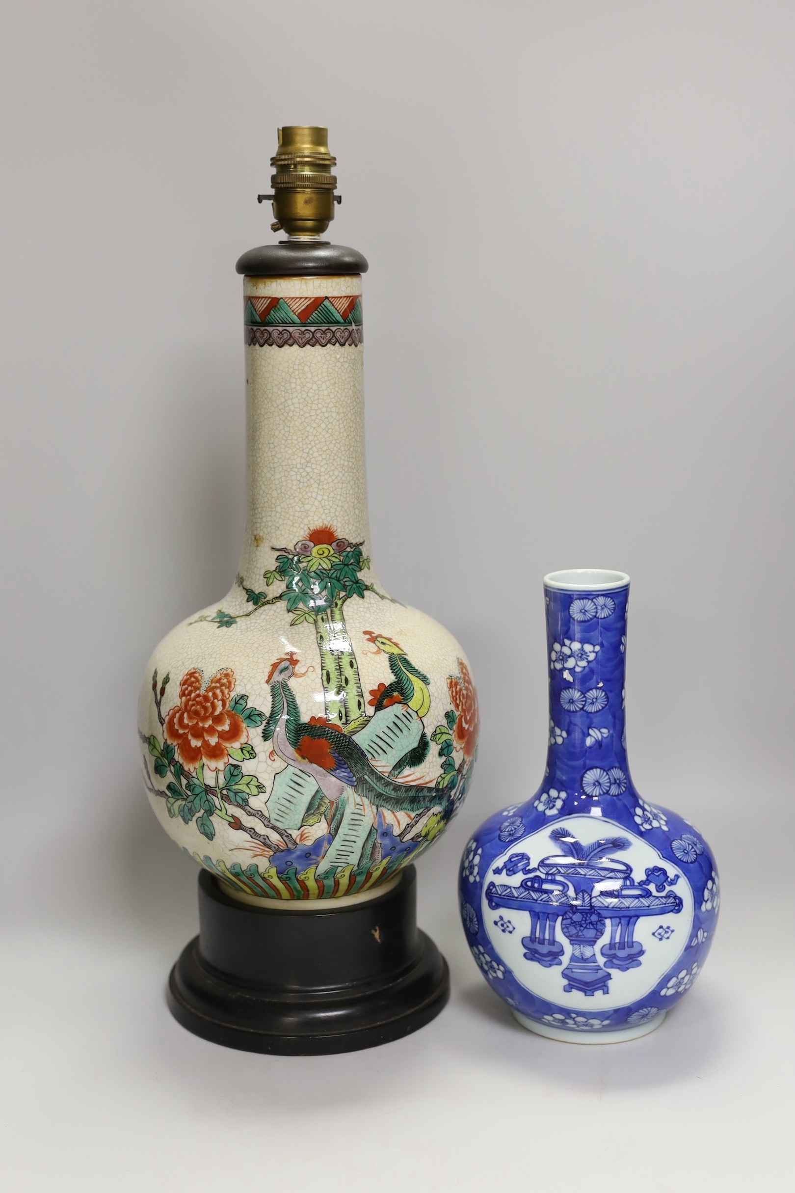 A Chinese crackle glaze ‘phoenix’ vase mounted as a lamp and a similar blue and white bottle vase
